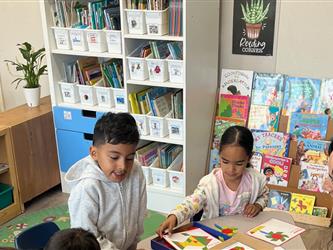 Young children learning with parent volunteers